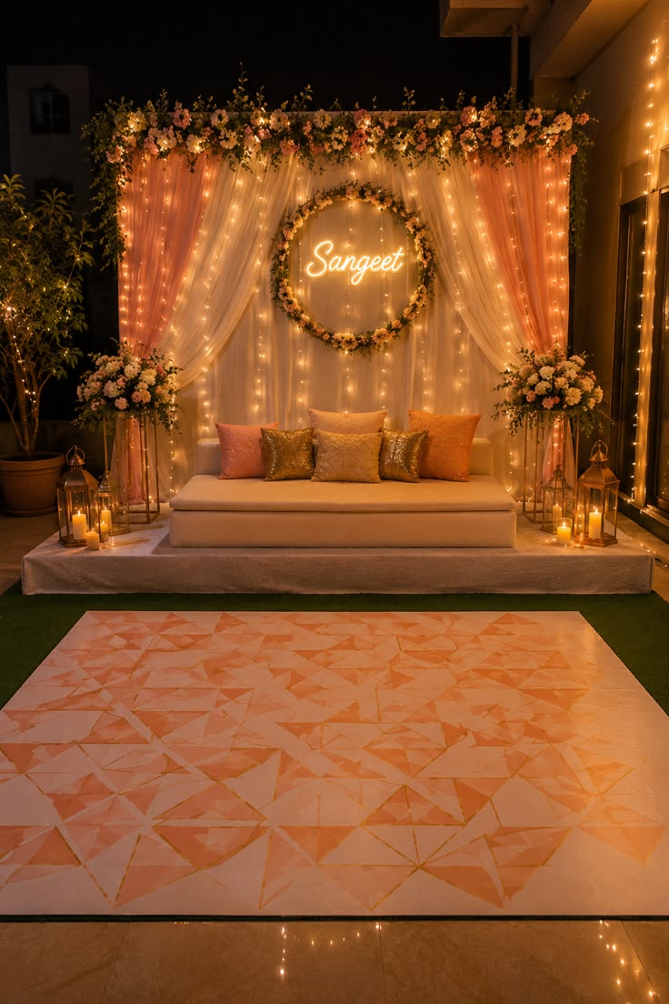Sangeet night stage with lights and flowers